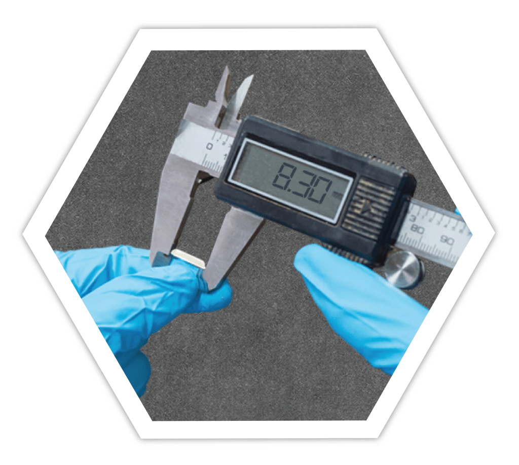 Quality control using digital caliper to measure the length of the rice.